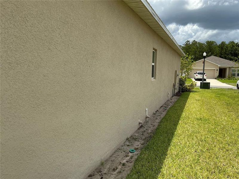 Front exterior of a new home in , Kissimmee, FL, highlighting curb appeal (Image 12).