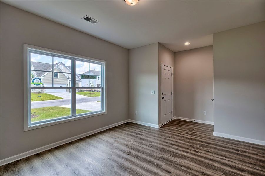 This bright room features durable flooring and amp