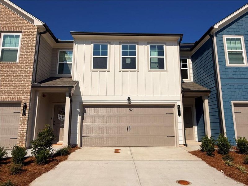 Front exterior of a new home in Laurelwood, Douglasville, GA, highlighting curb appeal (Image 23).