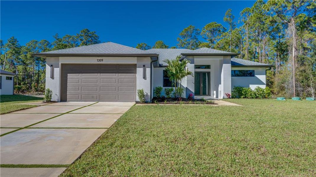 Front exterior of a new home in , Lehigh Acres, FL, highlighting curb appeal (Image 1). Front exterior of a new home in , Lehigh Acres, FL, highlighting curb appeal (Image 1).