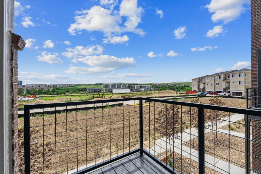 A fenced off area with buildings in the background. A fenced off area with buildings in the background.