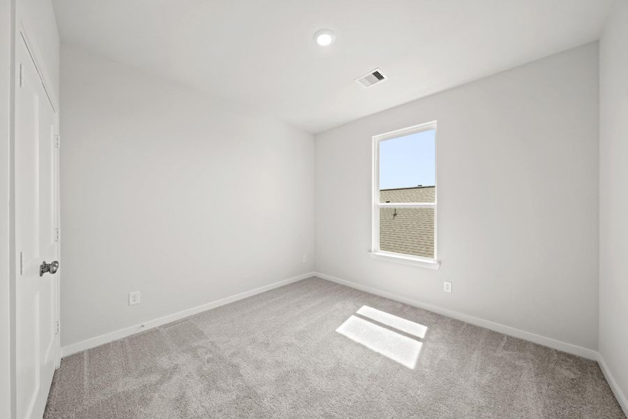 Spacious, unfurnished interior of a new home in Creekland Village at Bridgeland, Cypress (Image 23).