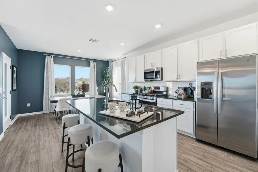 Representative furnished interior of a home built from the Harrier by Taylor Morrison in Longview, Del Valle (Image 5).