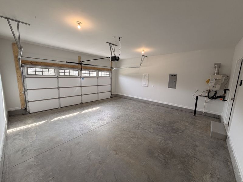 2 Car Garage showcases the Gas Tankless Hot Water Heater, and Insulated Garage Door!