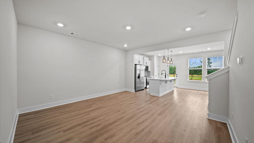 Hardwood flooring family room in two story townhome at Ransdell Pointe by DRB Homes in Spartanburg, SC Hardwood flooring family room in two story townhome at Ransdell Pointe by DRB Homes in Spartanburg, SC