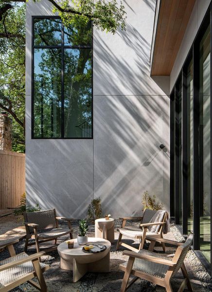 Private courtyard with a separate Fleetwood glass entry from the flex space off the guest suite.