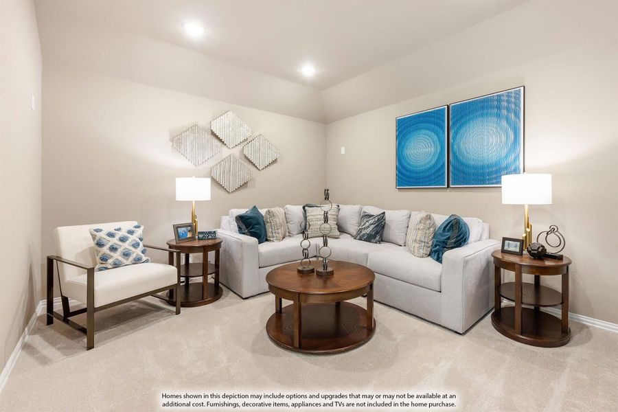 Living room with gray sectional sofa, round wood coffee table, and blue wall art on beige carpet Living room with gray sectional sofa, round wood coffee table, and blue wall art on beige carpet