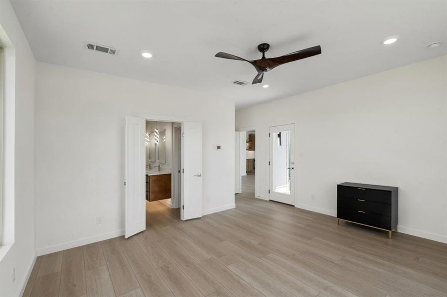2nd floor water front primary suite with access to patio & large bathroom.