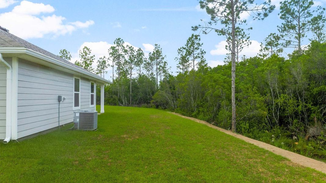 Exterior details and patio area of a home in Palmetto Bluff, Port Saint Joe (Image 4).