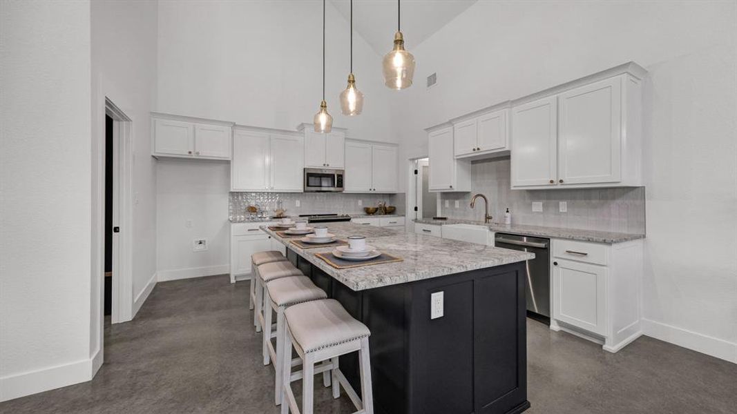 Oversized island and ample cabinet space in this kitchen!