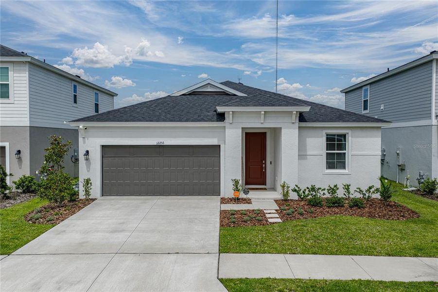 Front exterior of a new home in , Riverview, FL, highlighting curb appeal (Image 22).