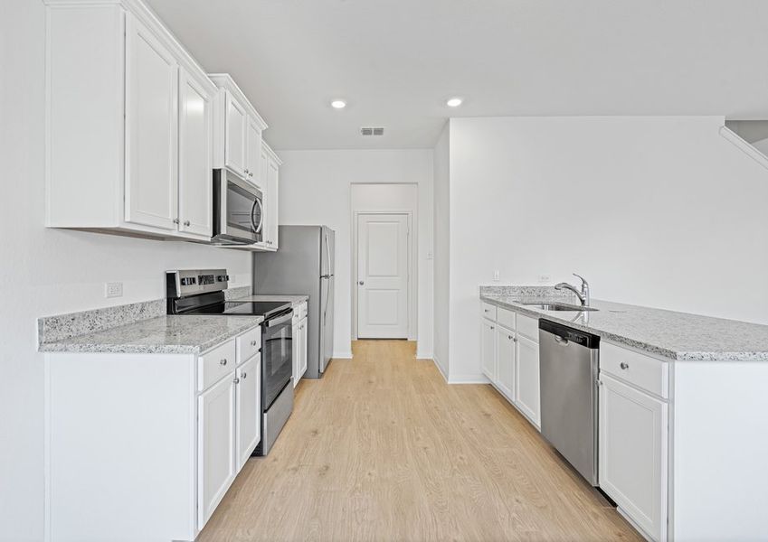 Chef-ready kitchen with granite countertops and stainless steel appliances