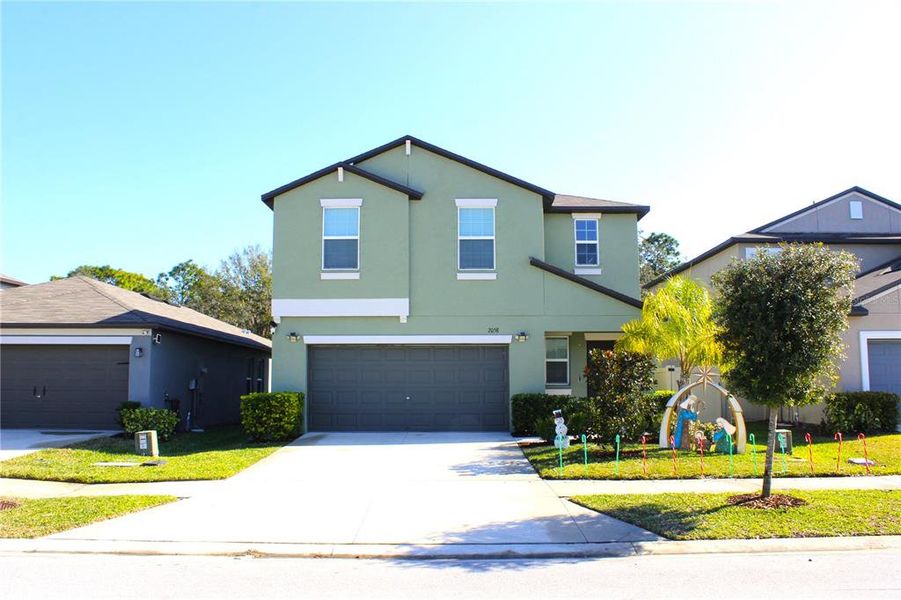 Front exterior of a new home in , Lutz, FL, highlighting curb appeal (Image 2). Front exterior of a new home in , Lutz, FL, highlighting curb appeal (Image 2).