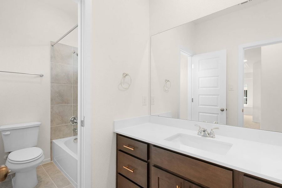 Representative furnished interior of a home built from the Maeve by Chesmar Homes in Deerbrooke Cottages, Leander (Image 12).
