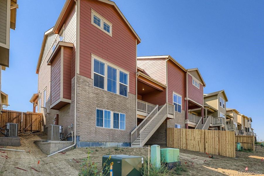 Front exterior of a new home in Parterre: Paired Homes, Thornton, CO, highlighting curb appeal (Image 2).