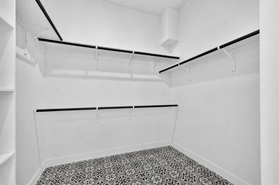 Primary Closet: The spacious walk-in closet in the primary suite is thoughtfully designed to keep everything beautifully organized, offering generous storage for clothing, shoes, and accessories. More than just a closet, it's a space that brings ease to your daily routine, making busy mornings and quiet evenings feel effortlessly organized and a little more luxurious.
