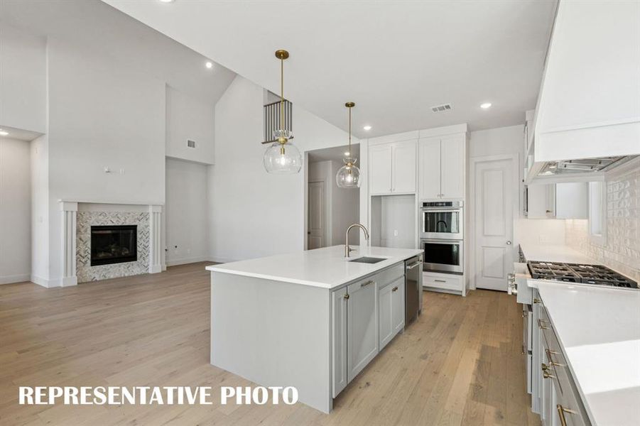 With outstanding storage and prep space, your inner chef will love entertaining in this fabulous open concept home!  REPRESENTATIVE PHOTO