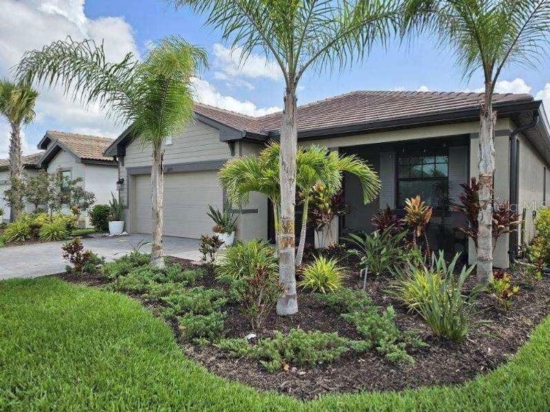 Front exterior of a new home in , Estero, FL, highlighting curb appeal (Image 22).