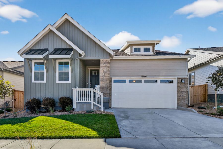 Front exterior of a new home in Trailstone, Arvada, CO, highlighting curb appeal (Image 1). Front exterior of a new home in Trailstone, Arvada, CO, highlighting curb appeal (Image 1).