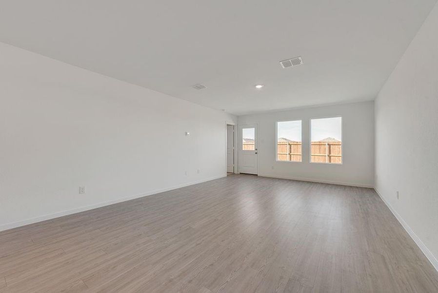 Unfurnished room featuring light wood-style floors and recessed lighting