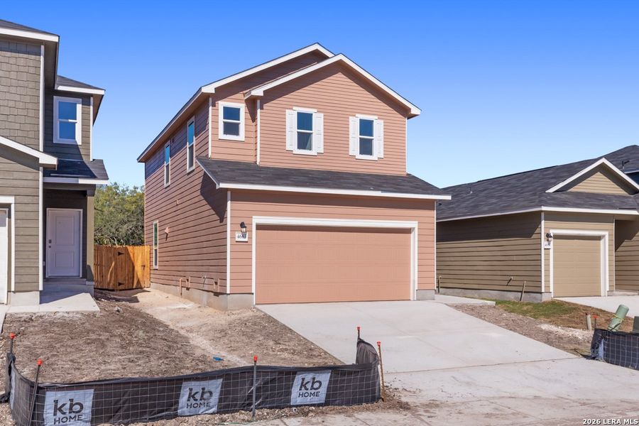 Front exterior of a new home in Spanish Trails Villas, San Antonio, TX, highlighting curb appeal (Image 20).