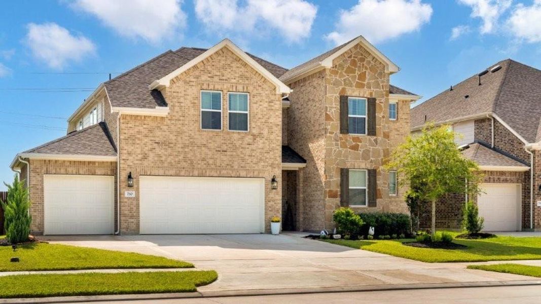 Front exterior of a new home in , League City, TX, highlighting curb appeal (Image 1).