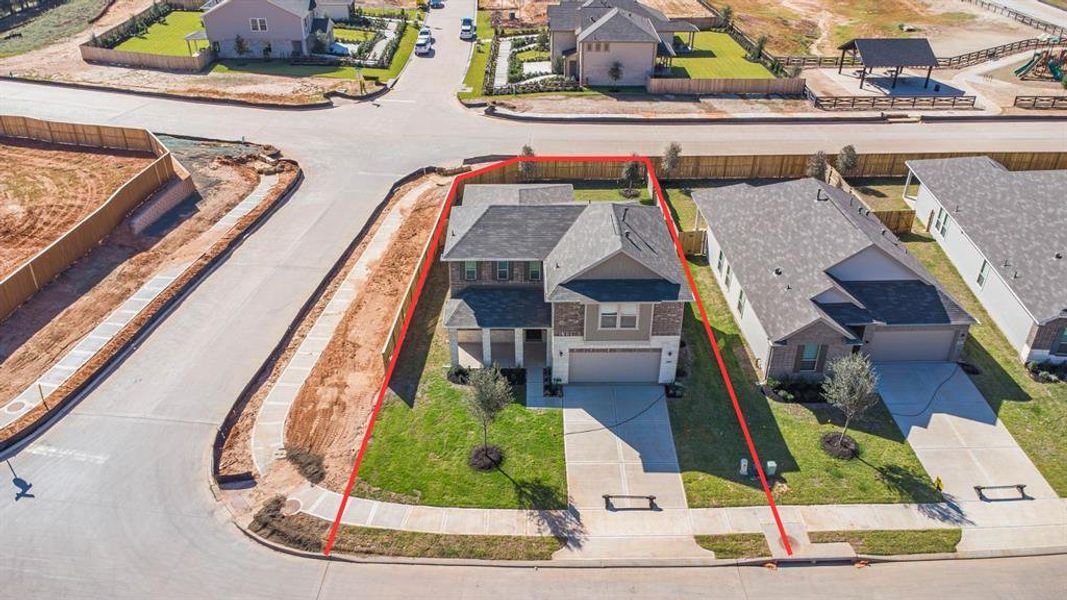 Amazing aerial shot of this gorgeous KB Home home situated on a CORNER LOT. Featuring lush landscaping, well manicured front lawn and a wonderful back.