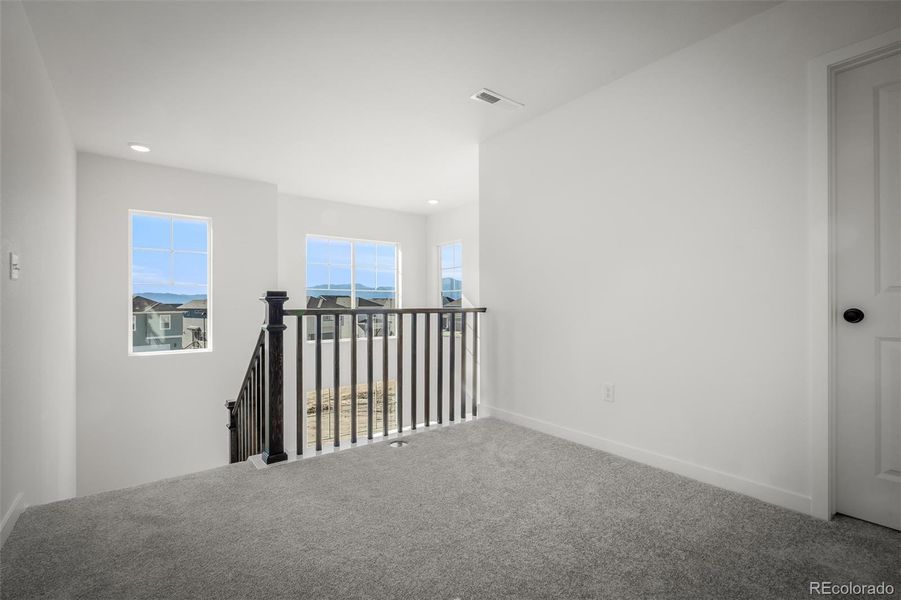 Spacious, unfurnished interior of a new home in Revel Crossing at Wolf Ranch – The Ascent Collection, Colorado Springs (Image 21).