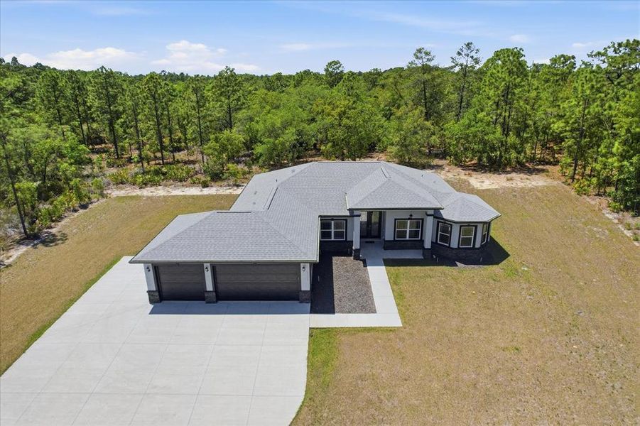 Front exterior of a new home in , Beverly Hills, FL, highlighting curb appeal (Image 24).