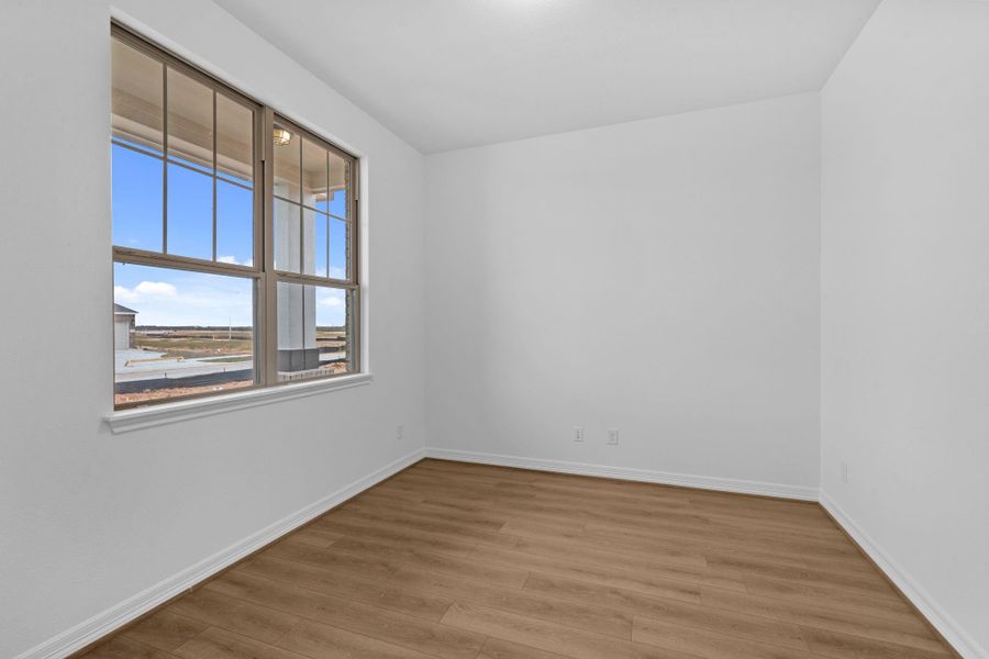 A light-filled study offering a peaceful space for work or reflection, grounded in natural textures.