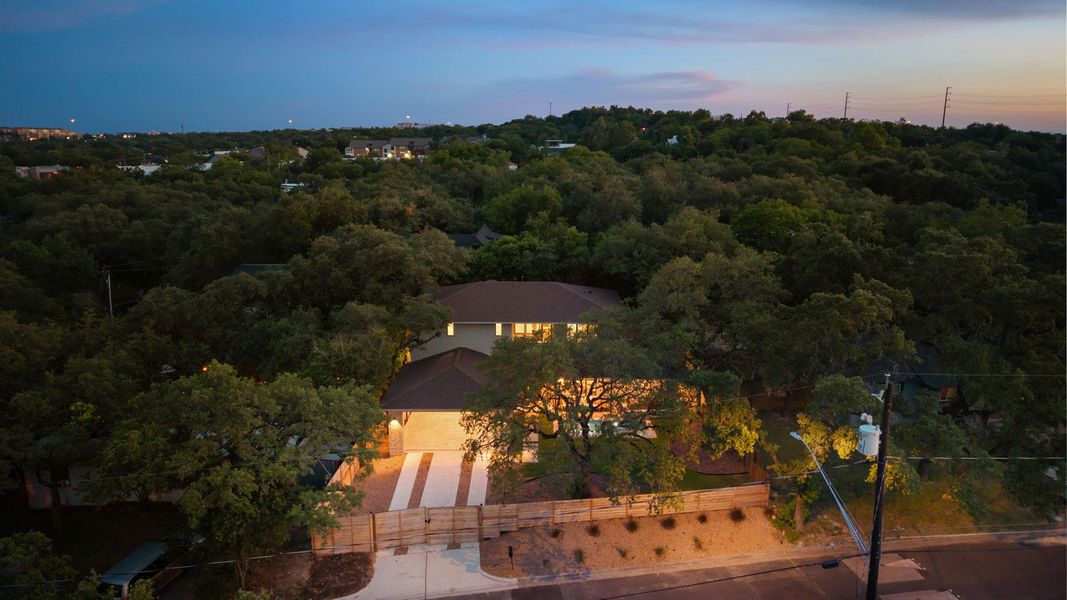 View from above of property with a forest