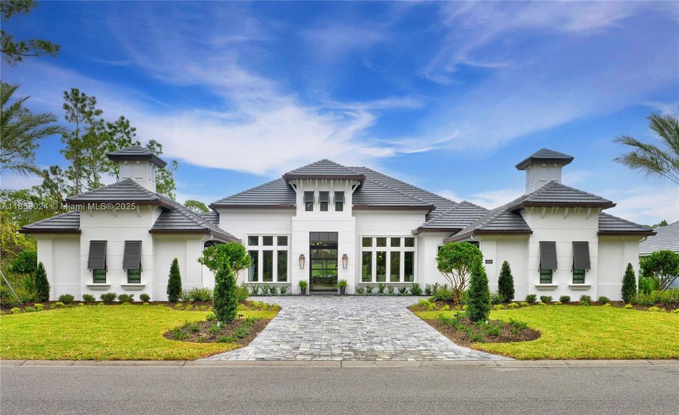 Front exterior of a new home in Prestwick Estates, Ormond Beach, FL, highlighting curb appeal (Image 2).