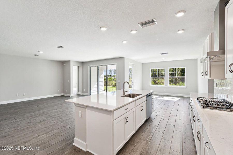 Furnished interior view inside a new home in Tributary 70', Yulee (Image 4).
