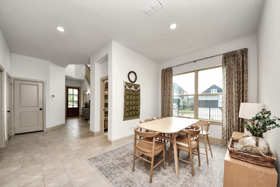 Open dining area with easy access to the kitchen, creating a comfortable space for meals and gatherings.
