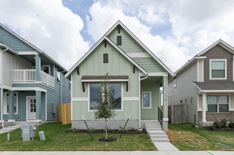 Front exterior of a new home in Blanco Vista, San Marcos, TX, highlighting curb appeal (Image 18).
