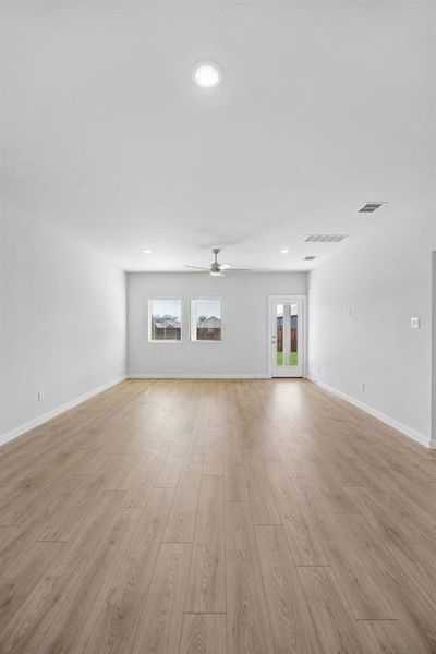 Living and Dining Rooms in the Mesquite home plan by Trophy Signature Homes – REPRESENTATIVE PHOT