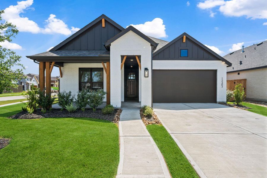 Front exterior of a new home in Riceland: 50ft. lots, Mont Belvieu, TX, highlighting curb appeal (Image 18). Front exterior of a new home in Riceland: 50ft. lots, Mont Belvieu, TX, highlighting curb appeal (Image 18).