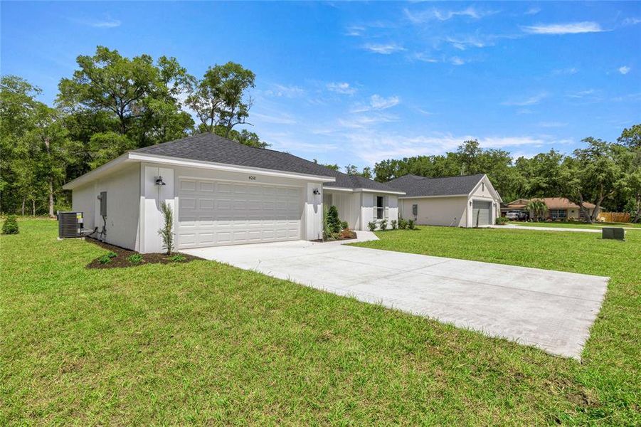 Front exterior of a new home in , Ocala, FL, highlighting curb appeal (Image 15).