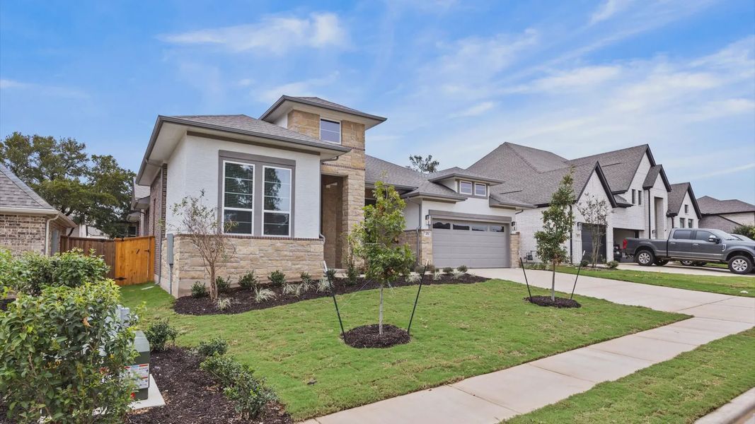 Front exterior of a new home in 6 Creeks, Kyle, TX, highlighting curb appeal (Image 17).