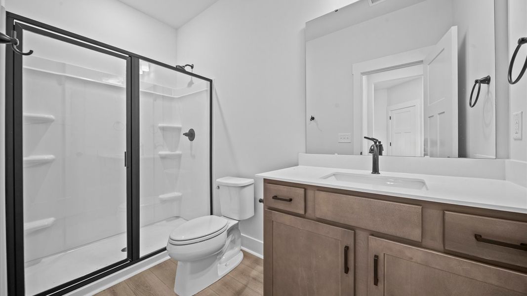 Top-notch bathroom with current fixtures, tasteful materials, and elevated charm