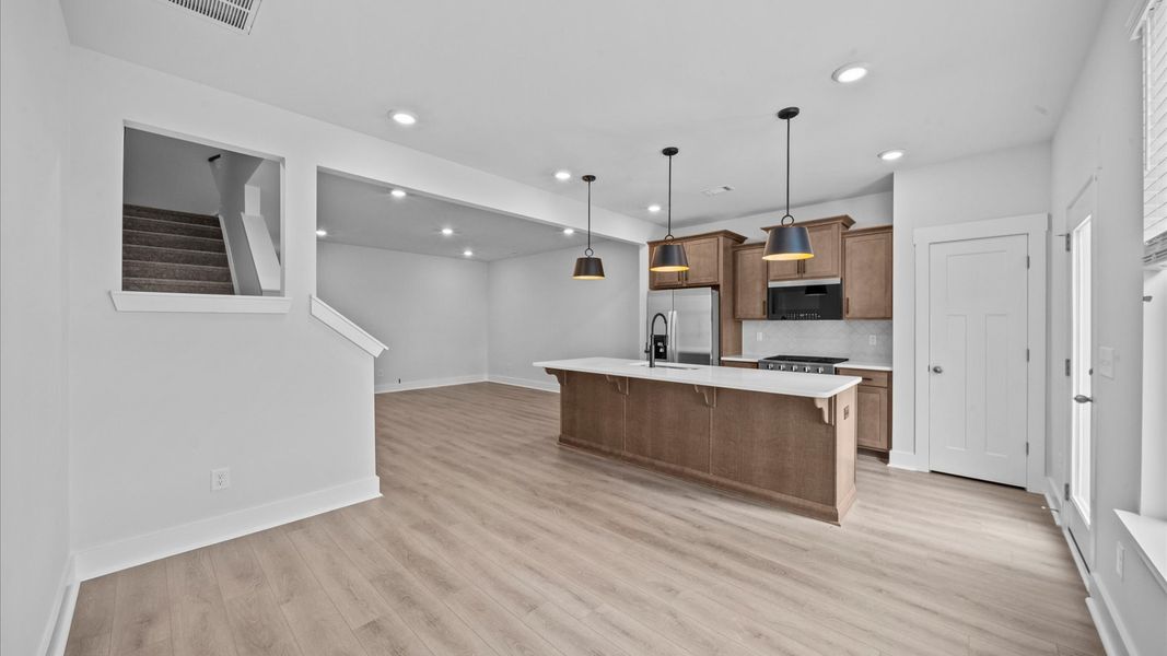 Open concept breakfast area adjacent from kitchen in two story townhome at Ransdell Pointe by DRB Homes in Spartanburg, SC