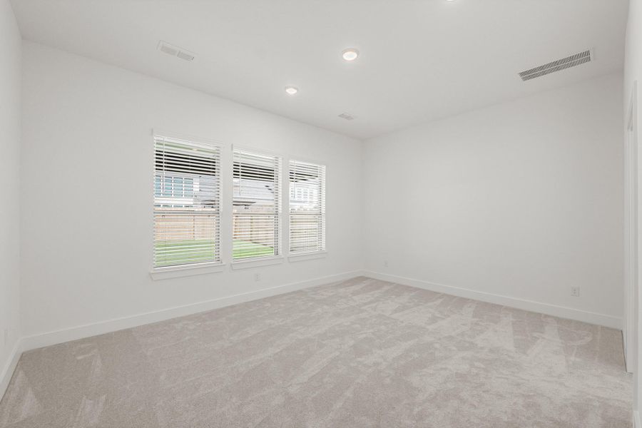 Serene Main Bedroom With Tranquil Views Of The Backyard