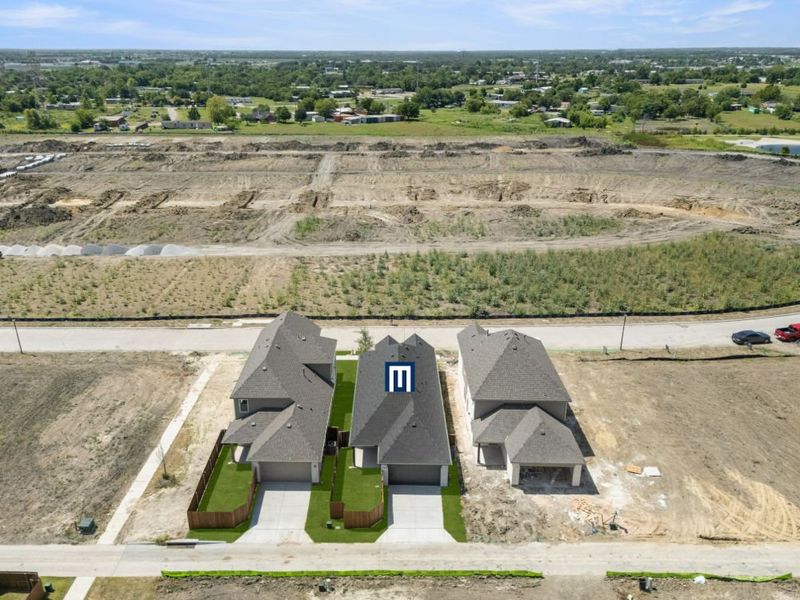 Image 46 representing the Cypress by UnionMain Homes in Edgewater, Fate, TX.