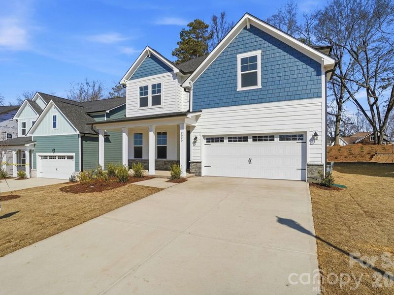 Front exterior of a new home in Enclave at Belmont, Belmont, NC, highlighting curb appeal (Image 28).