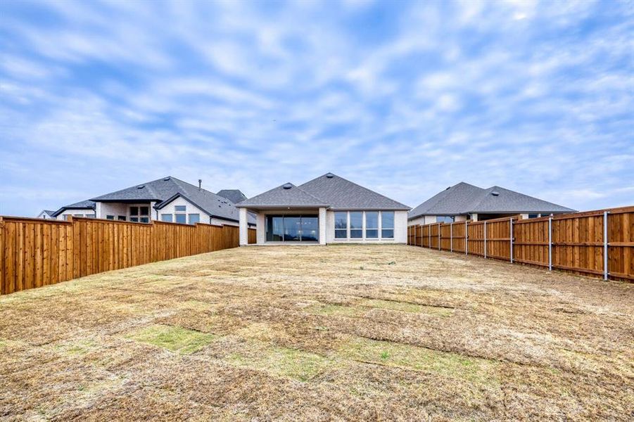 Fenced backyard featuring a patio area