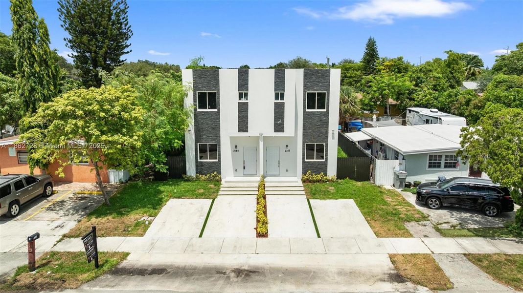 Front exterior of a new home in , Pompano Beach, FL, highlighting curb appeal (Image 16).