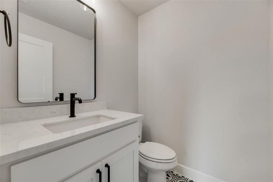 Bathroom with vanity and toilet