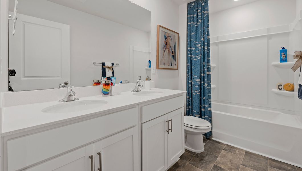 Furnished interior view inside a new home in Bentley Park, Greenwood (Image 22).