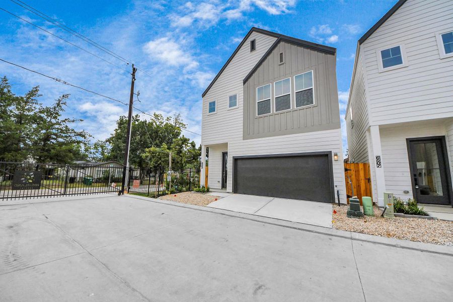 Front exterior of a new home in Highland Gardens, Houston, TX, highlighting curb appeal (Image 23).