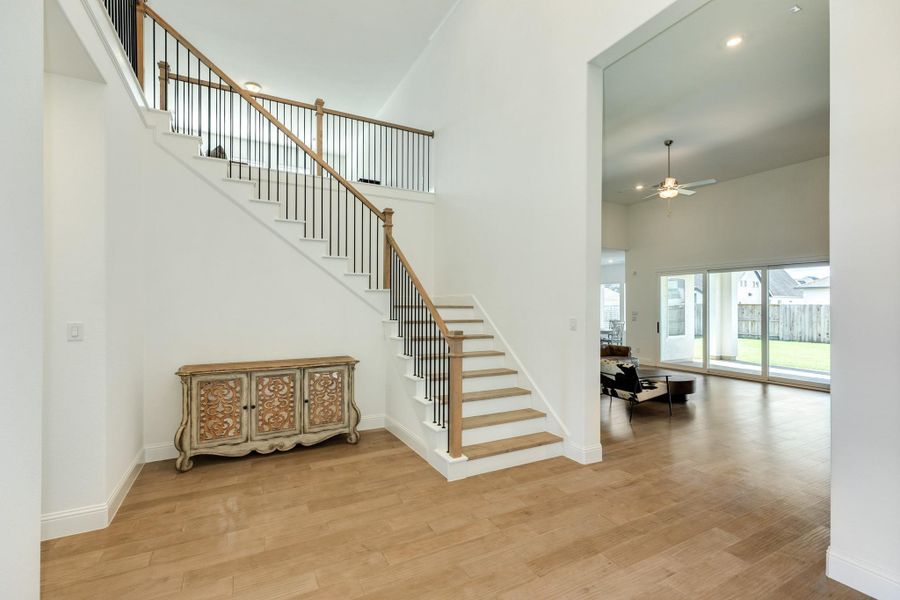 Upon entering the foyer, the guest ensuite, featuring a private bathroom, is located to your immediate left.